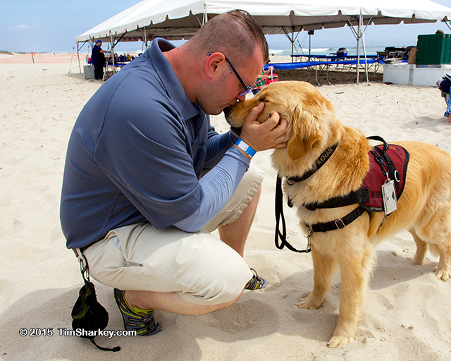 U.S. Army Vet Adam Campbell and Kenan, his service dog, at the 2015 paws4vets benefit. (Credit: Tim Sharkey)