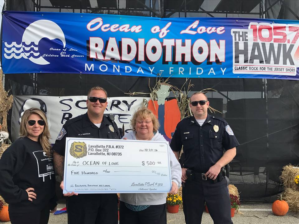 Lavallette PBA members drop off a check at the 105.7 The Hawk billboard to support Oceans of Love. (Photo: Lavallette PBA)