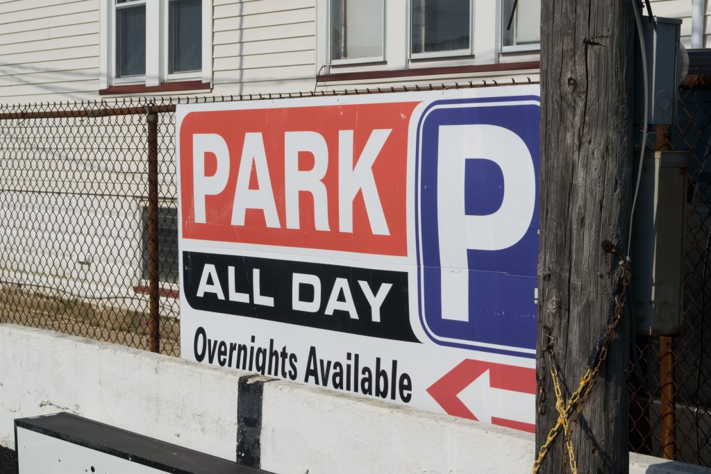 Signs at a private parking lot in Seaside Heights, N.J., July 2019. (Photo: Daniel Nee)