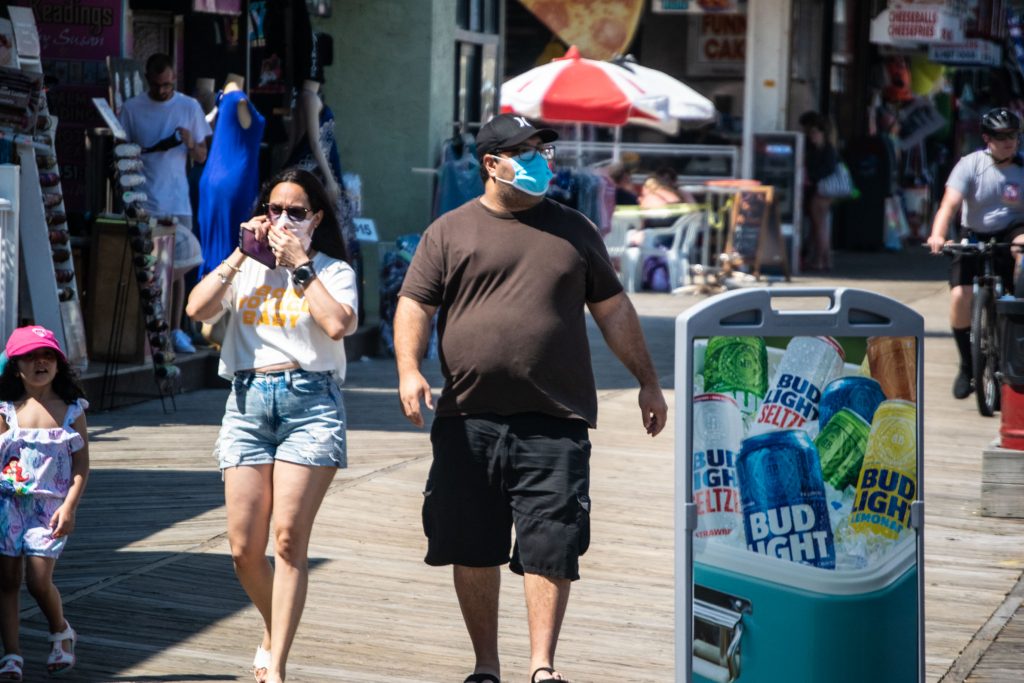 Visitors to the boardwalk and rides in Seaside Heights, N.J. wear face masks July 8, 2020. (Photo: Daniel Nee)