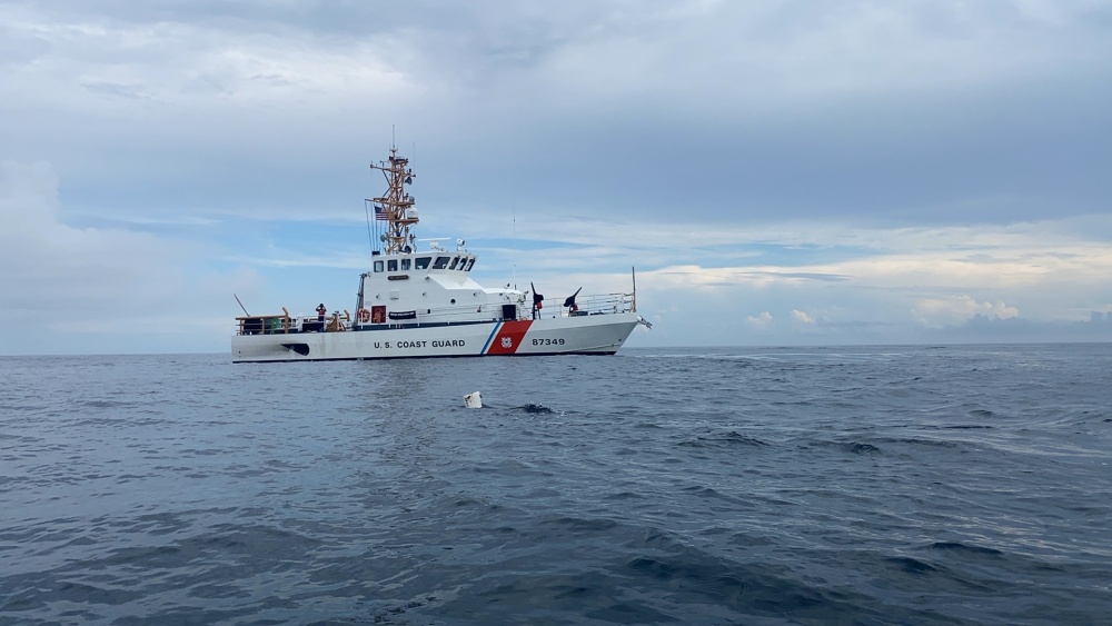 Coast Guard Cutter Shearwater arrives on scene where a sea turtle is entangled in a fishing trap line 11 miles southeast of Cape May, New Jersey, August 13, 2020. The crew sprang into action to rescue the turtle when they spotted sharks beginning to swarm. (U.S. Coast Guard photo by Fireman Jason Breckner) 