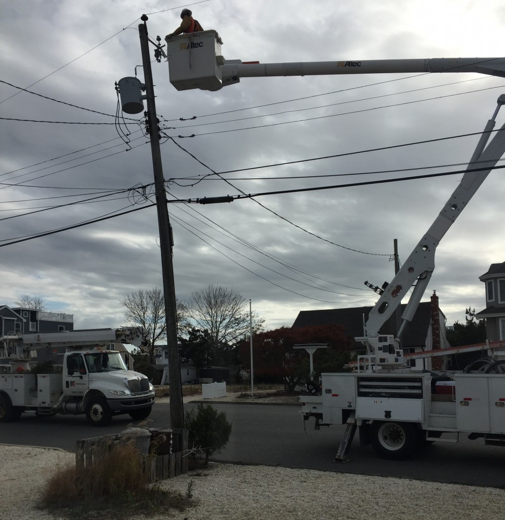 A new utility pole being installed in an Ocean County barrier island community. (Photo: Daniel Nee)