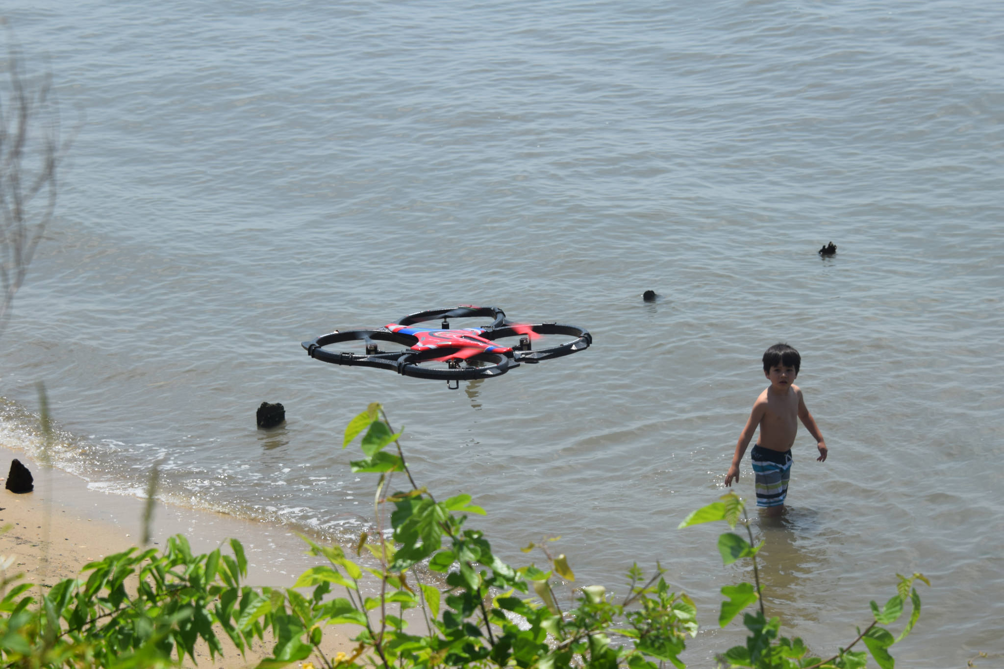 A drone in use near a beach. (Photo: Tony Alter/Flickr)