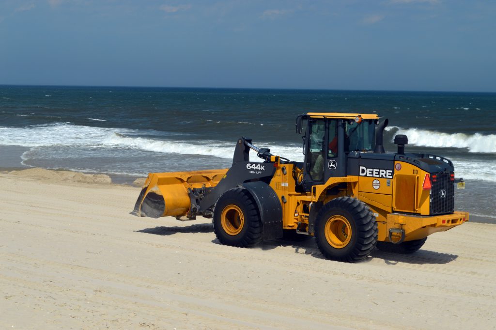 A tractor moves sand on the Ortley Beach oceanfront, April 26, 2016. (Photo: Daniel Nee)