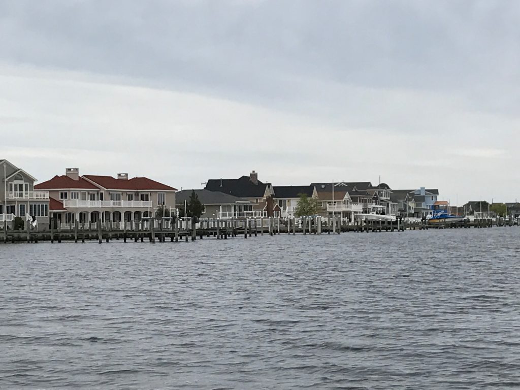 A boat dock extends out into Barnegat Bay. (Photo: Daniel Nee)