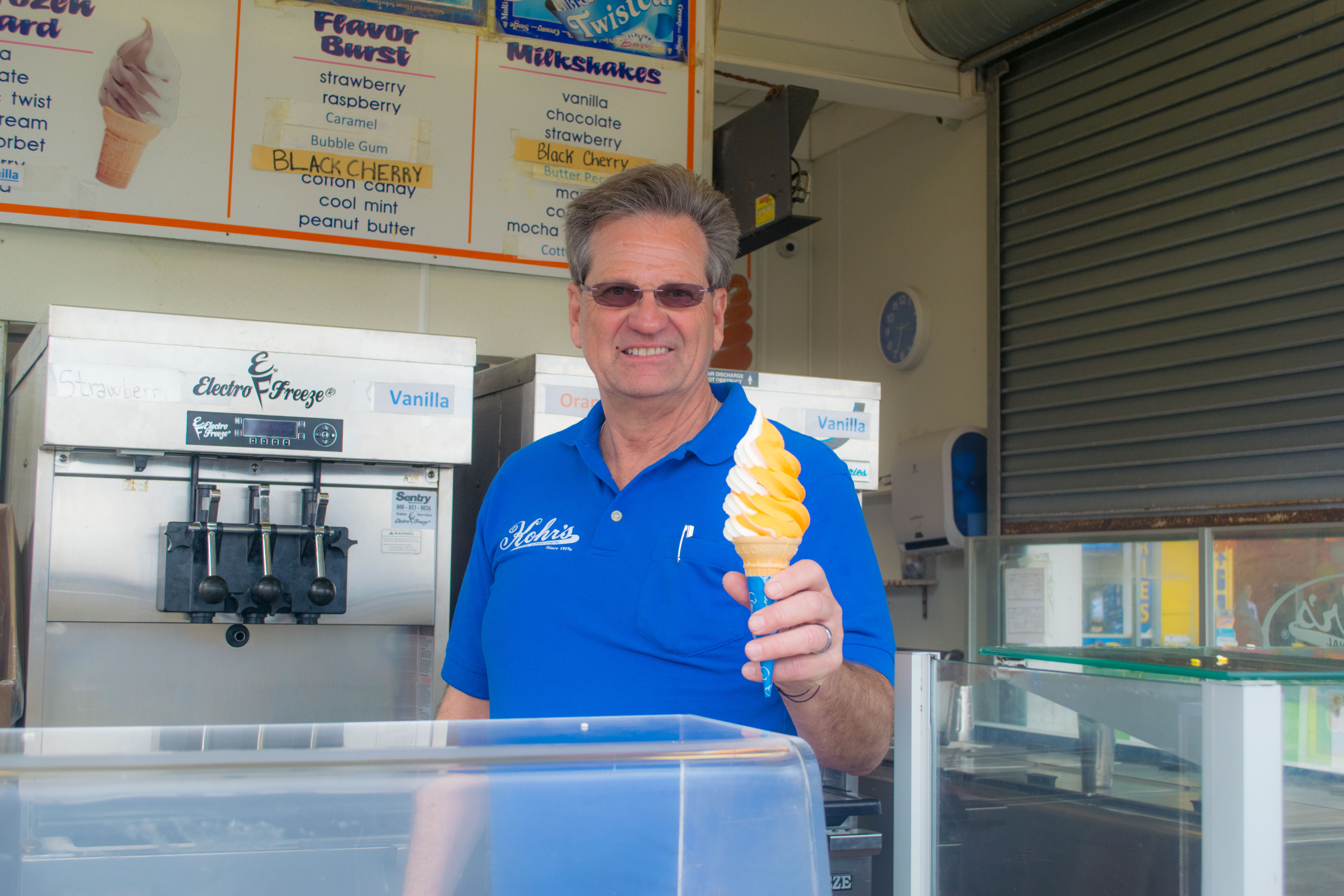 Greg Kohr serves a cone of frozen custard outside one of his three stores in Seaside Heights, N.J., May 2019. (Photo: Daniel Nee)