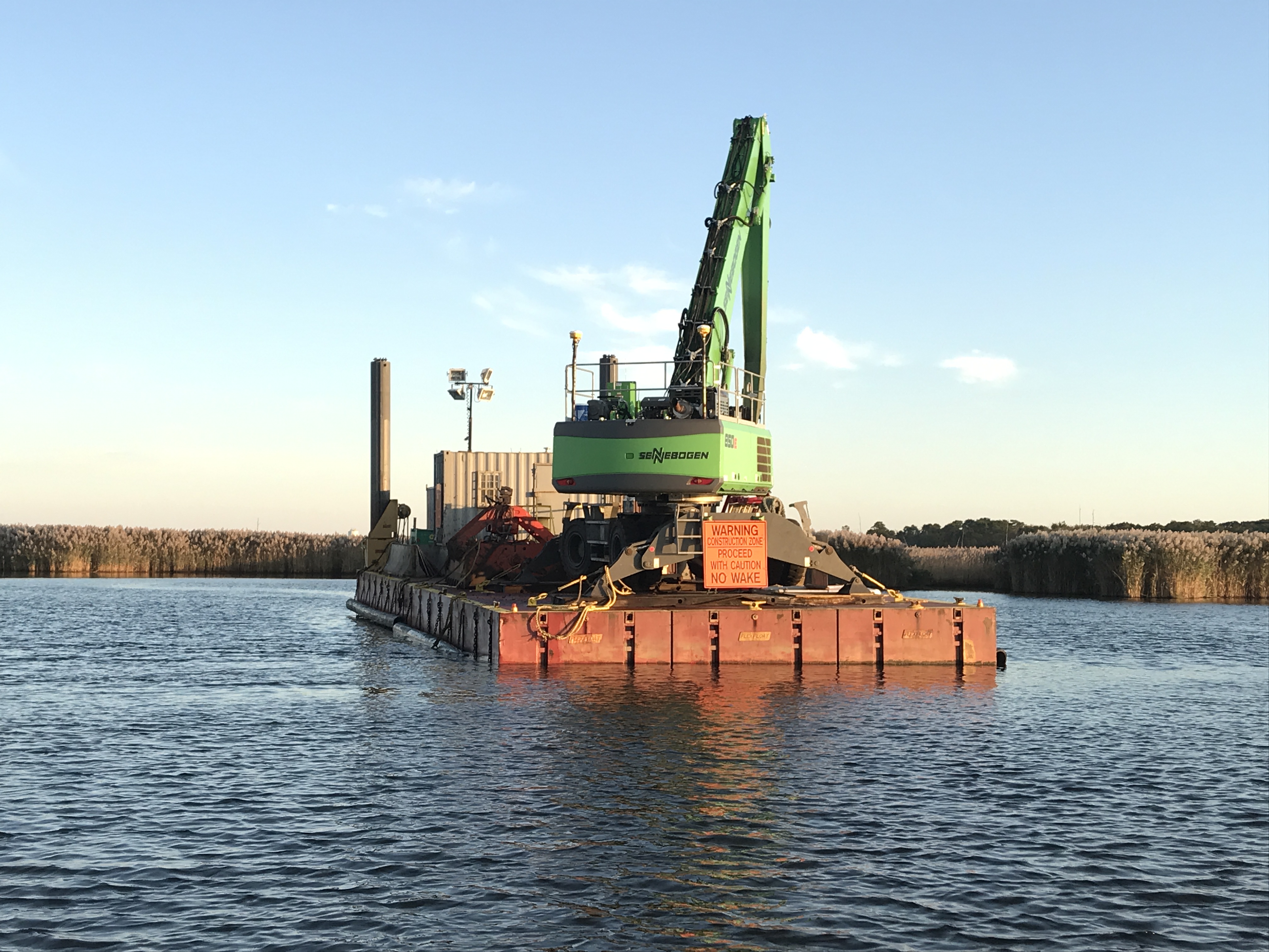 A dredge barge rests in the narrows of the Metedeconk River on Oct. 15, 2019. (Photo: Daniel Nee)