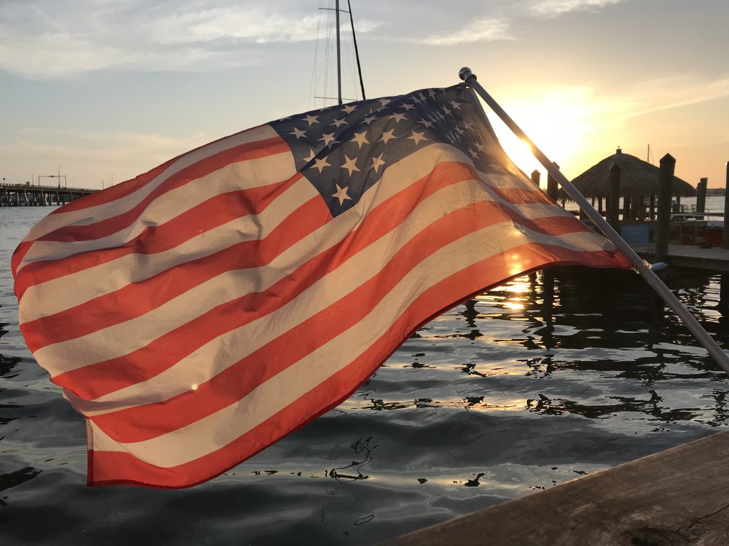 An American flag against a sunset. (Photo: Daniel Nee)