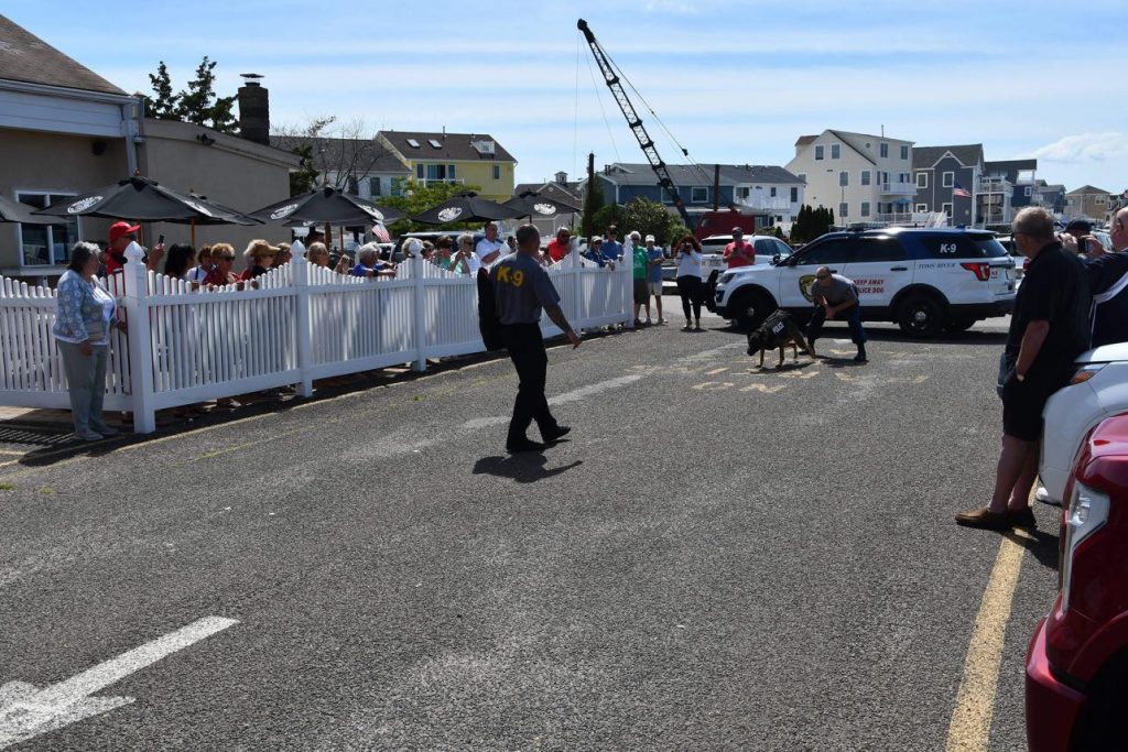 The Toms River Police Department K9 handlers and their partners perform a demonstration at the Ortley Beach Moose Lodge, July 2021. (Credit: TRPD)