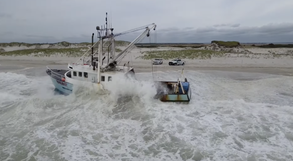 The Bear, a 68-foot scallop boat, imperiled at Island Beach State Park. (Credit: YouTube/SuazOnn)