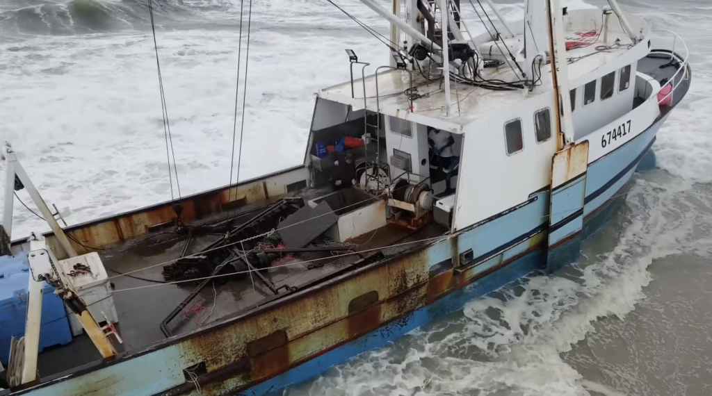 The Bear, a 68-foot scallop boat, imperiled at Island Beach State Park. (Credit: YouTube/SuazOnn)