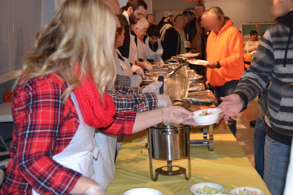 Volunteers serve meals at Simon's Soup Kitchen in Seaside Heights. (Faces of patrons have been blurred for privacy purposes.) (Photo: Simon's Soup Kitchen)