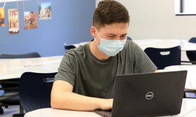 A student wears a face mask while in school. (Credit: Jill Carlson (jillcarlson.org)/ Flickr)