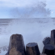 A wave crashes against the rocks at Manasquan Inlet, April 19, 2022. (Photo: Daniel Nee)