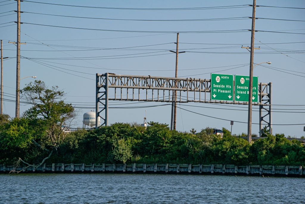 Highway signs entering the barrier island from the Route 37 bridge. (Photo: Daniel Nee)