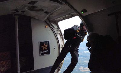 A jumper from the U.S. Army Golden Knights parachutes out of a Dash-8 at Joint Base McGuire-Dix-Lakehurst. (Photo: Shorebeat)