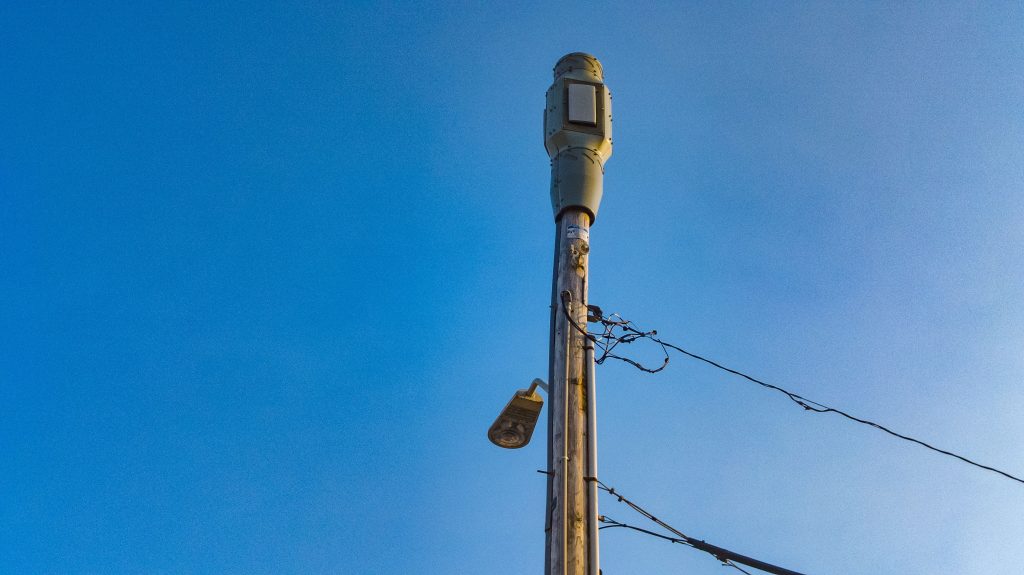 A small 5G wireless facility on top of an existing timber pole, Lavallette, N.J., May 2023. (Photo: Shorebeat)