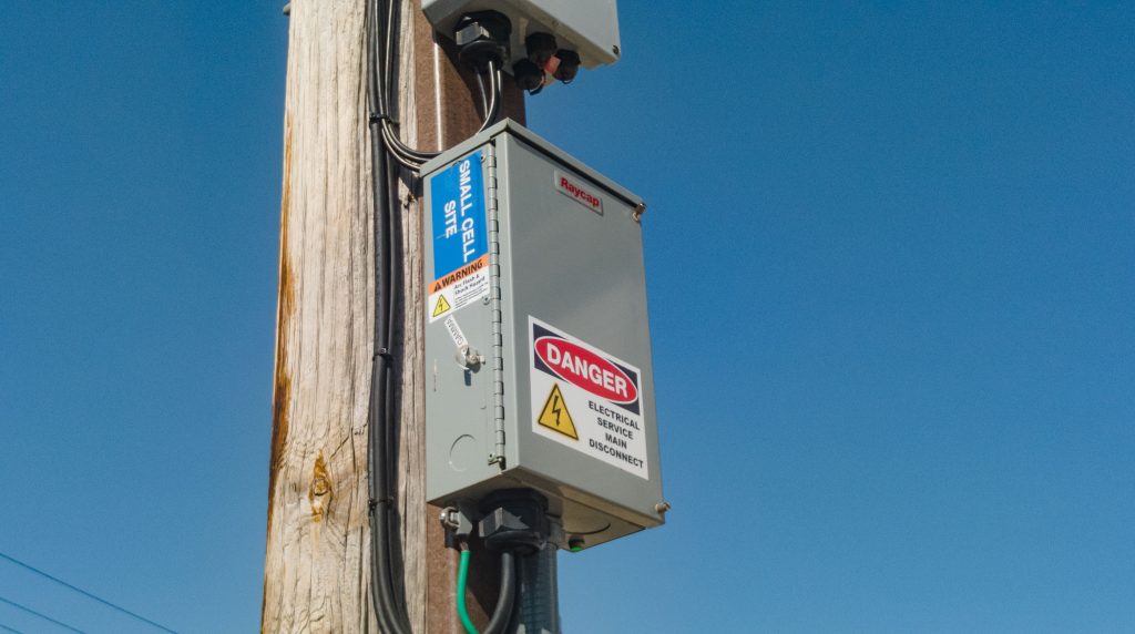 A small 5G wireless facility on top of an existing timber pole, Lavallette, N.J., May 2023. (Photo: Shorebeat)