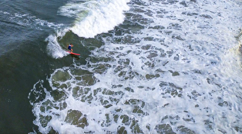 Surfers catch waves near Casino Pier, Aug. 30, 2023. (Photo: Shorebeat)