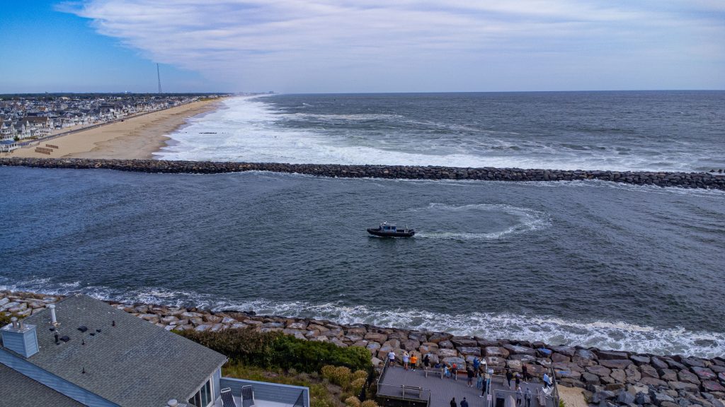 Rescue boats search Manasquan Inlet as waves pound the jetty during a search for a man from a capsized vessel, Sept. 15, 2023. (Photo: Shorebeat)