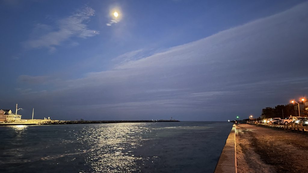 The moon (center) and Jupiter (left) over Manasquan Inlet. (Photo: Shorebeat)
