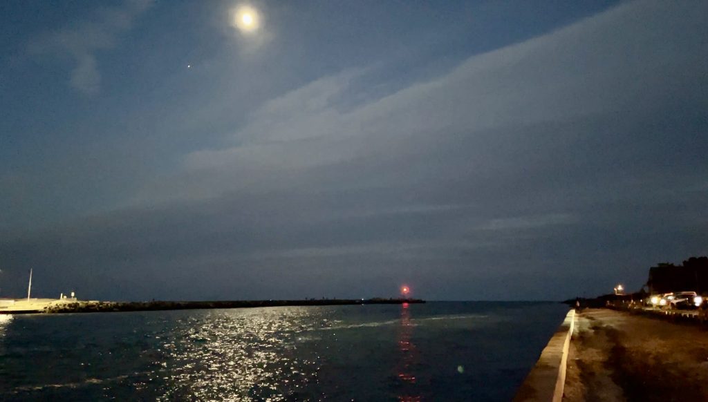 The moon (center) and Jupiter (left) over Manasquan Inlet. (Photo: Shorebeat)