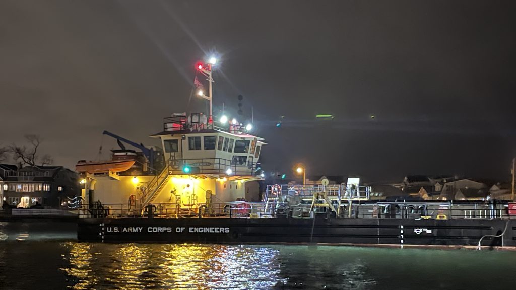 The dredge boat Murden clears Manasquan Inlet at night, Feb. 22, 2024. (Credit: Shorebeat)