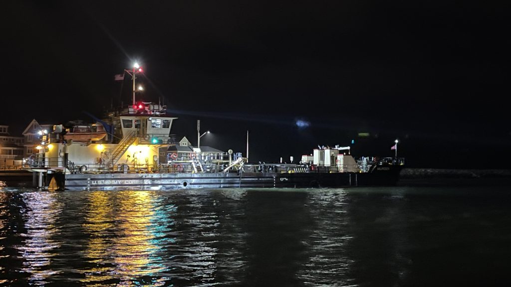 The dredge boat Murden clears Manasquan Inlet at night, Feb. 22, 2024. (Credit: Shorebeat)