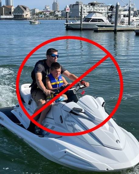 A passenger sits in front of a jet ski driver. (Source: New Jersey State Police)