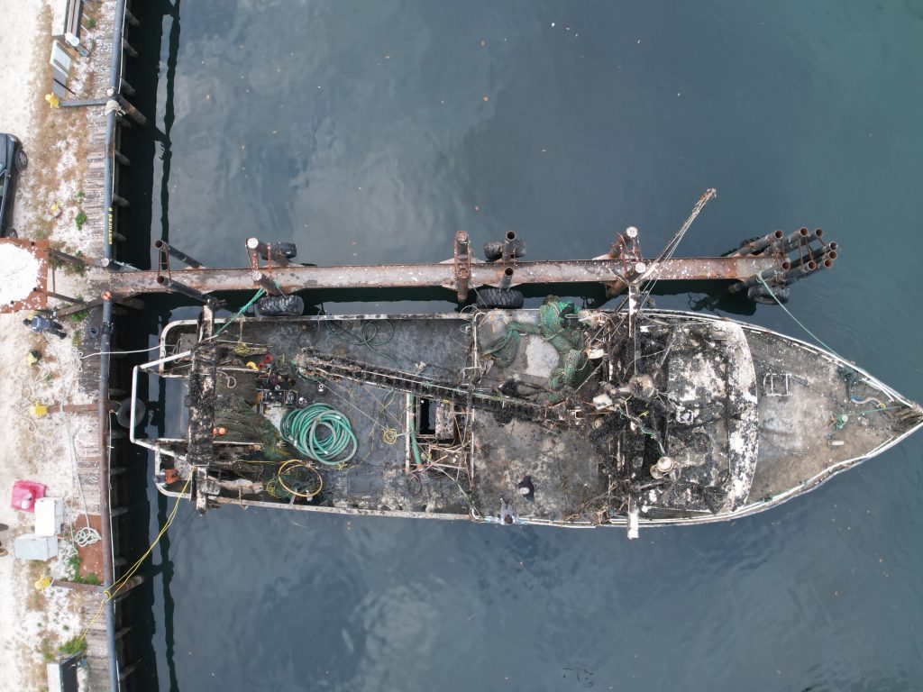 The Susan Rose, submerged under the Atlantic Ocean for a year, is tied up along Channel Drive in Point Pleasant Beach after being re-floated, Nov. 20, 2024. (Photo: John Barrett)