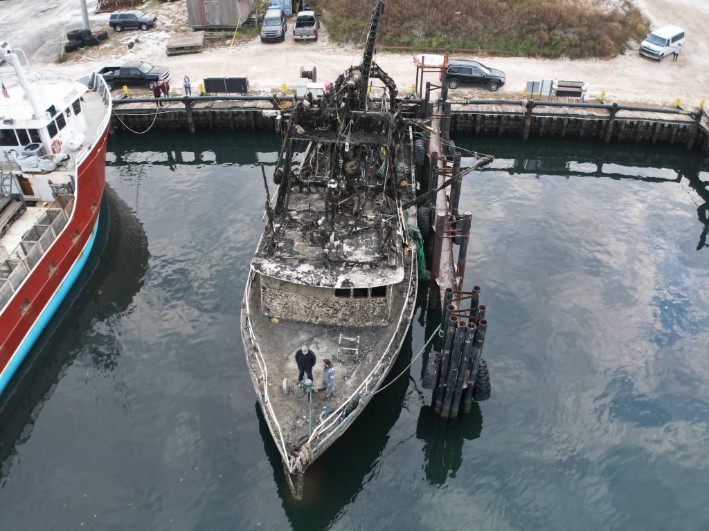 The Susan Rose, submerged under the Atlantic Ocean for a year, is tied up along Channel Drive in Point Pleasant Beach after being re-floated, Nov. 20, 2024. (Photo: John Barrett)