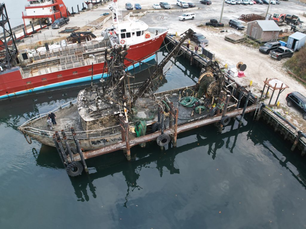 The Susan Rose, submerged under the Atlantic Ocean for a year, is tied up along Channel Drive in Point Pleasant Beach after being re-floated, Nov. 20, 2024. (Photo: John Barrett)