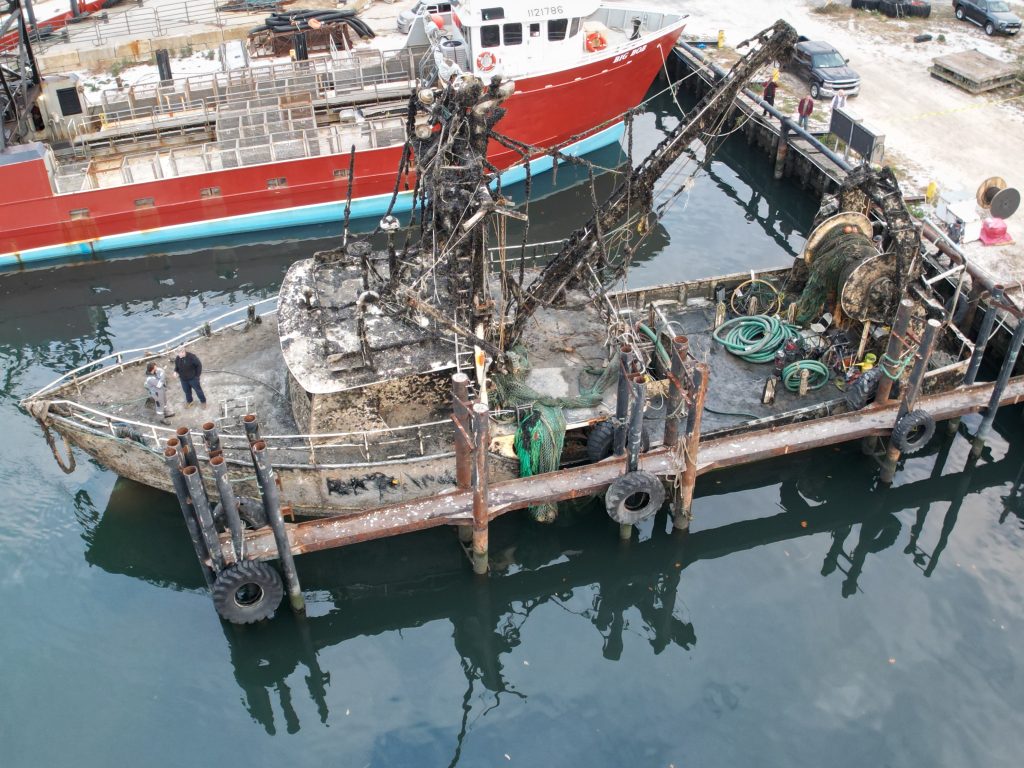 The Susan Rose, submerged under the Atlantic Ocean for a year, is tied up along Channel Drive in Point Pleasant Beach after being re-floated, Nov. 20, 2024. (Photo: John Barrett)