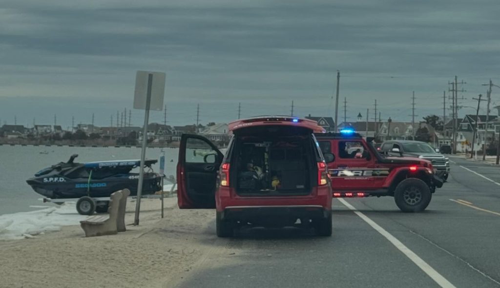 Rescuers check on a fox that was reported floating on a breakway dock in Barnegat Bay, Jan. 2025. (Photo: Seaside Park Fire Department)